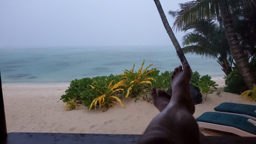 When it rains, sit on the covered deck with a favorite beverage and watch the rain spray across the blue reef just feet away.